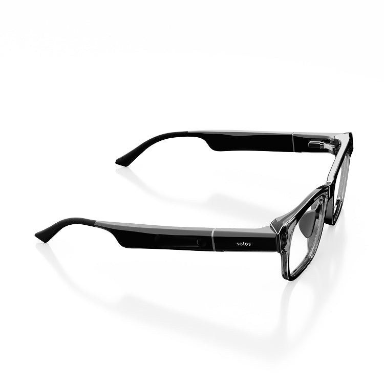 Black smartglasses with a dark gray transparent frame front from the side on a white background. On the side it reads 'Solos'.