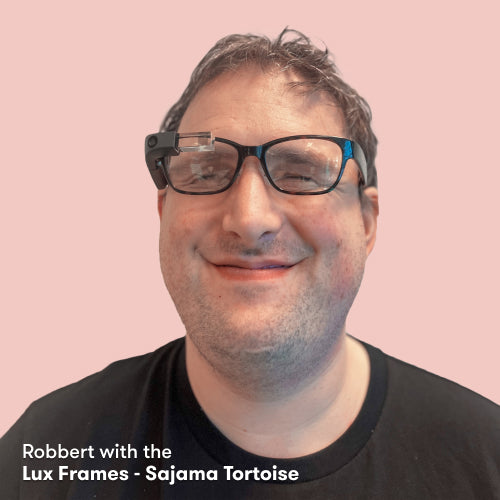 Portrait of Robbert wearing the Envision Glasses with the Lux Frames - Sajama Tortoise